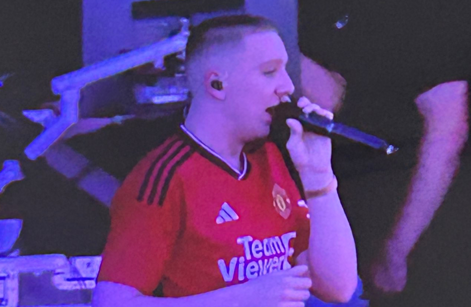 Photo: Rapper Aitch spotted on stage at Glastonbury wearing new Man United shirt CaughtOffside