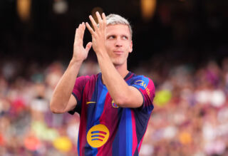Dani Olmo applauds the Barcelona fans